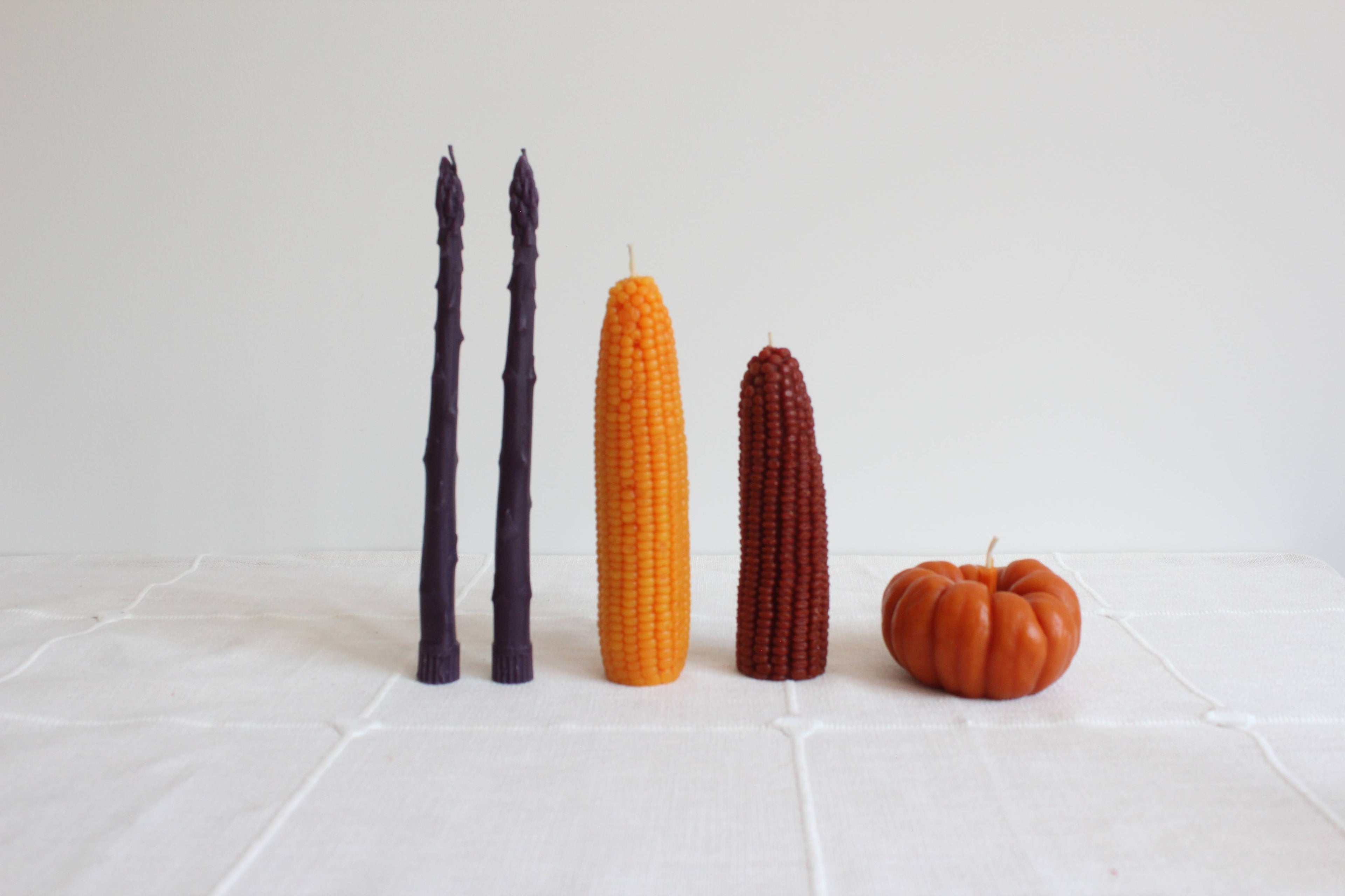 Purple Asparagus Beeswax Candle Taper Pair — styled