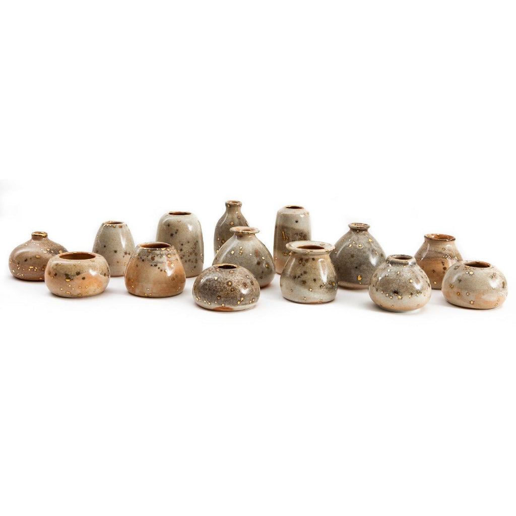 Collection of Stardust bud vases showing glaze variation from grey to cream to apricot