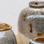Close-up detail of 24 carat gold flecks on the Shino glaze of a Stardust vase